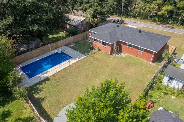 an aerial view of residential houses with outdoor space