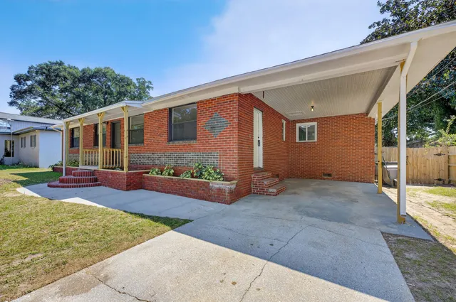 front view of a house with a yard