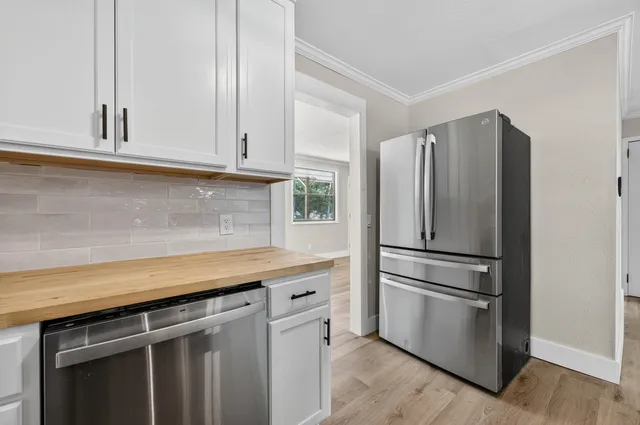 a kitchen with appliances and cabinets