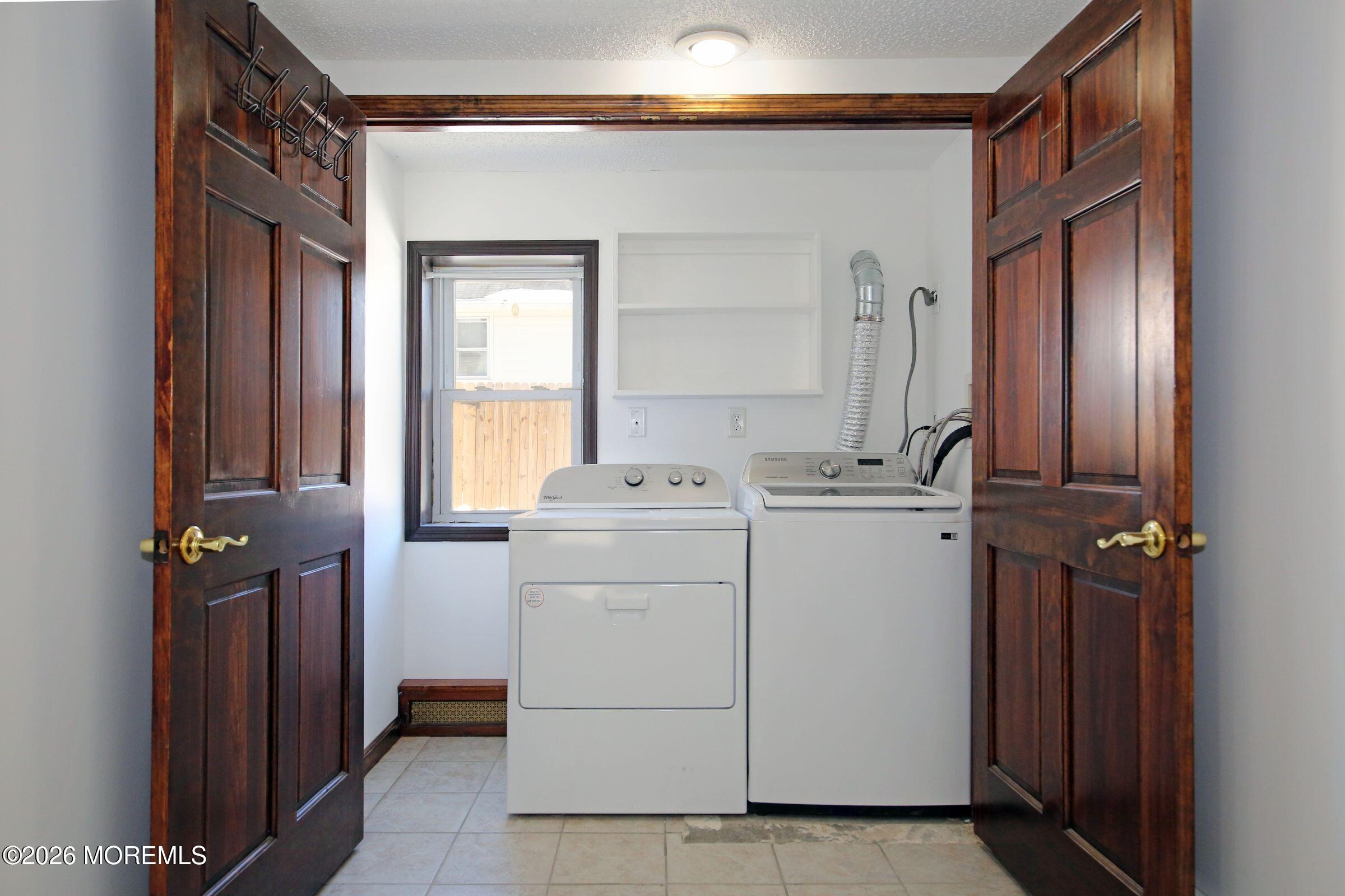 60 Matthew Street, Unit 1 Highlands, NJ 07732 - Photo 18 of 33 a utility room with dryer and washer