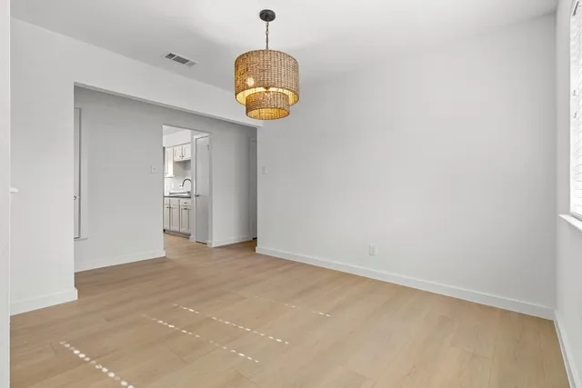 an empty room with a mirror