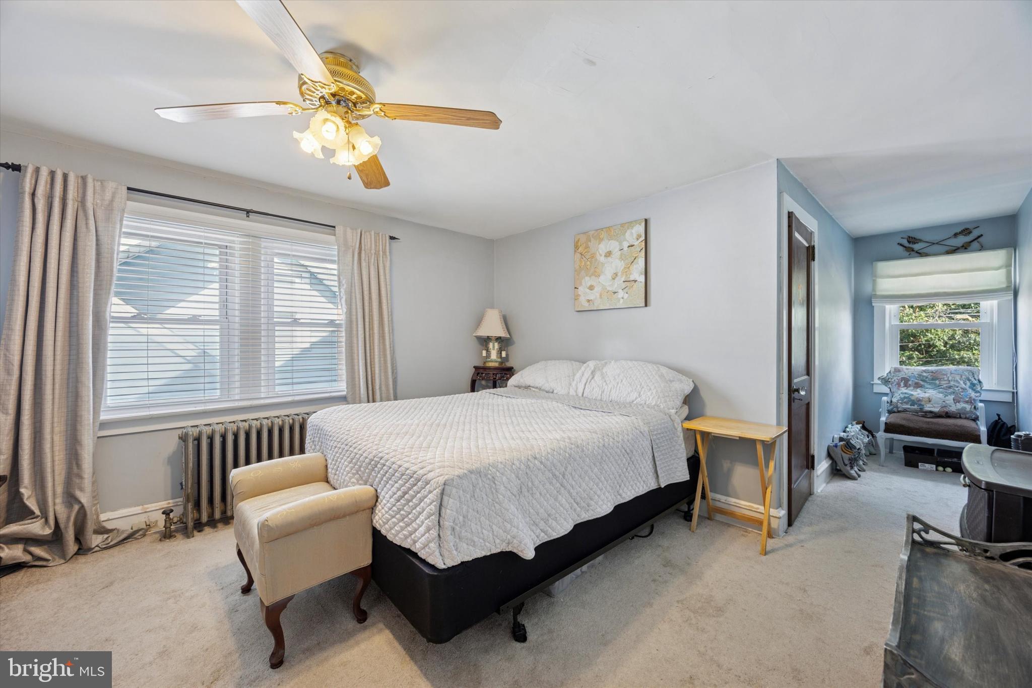 204 Media Line Road Newtown Square, PA 19073 - Photo 11 of 15 a bedroom with a bed and a chandelier