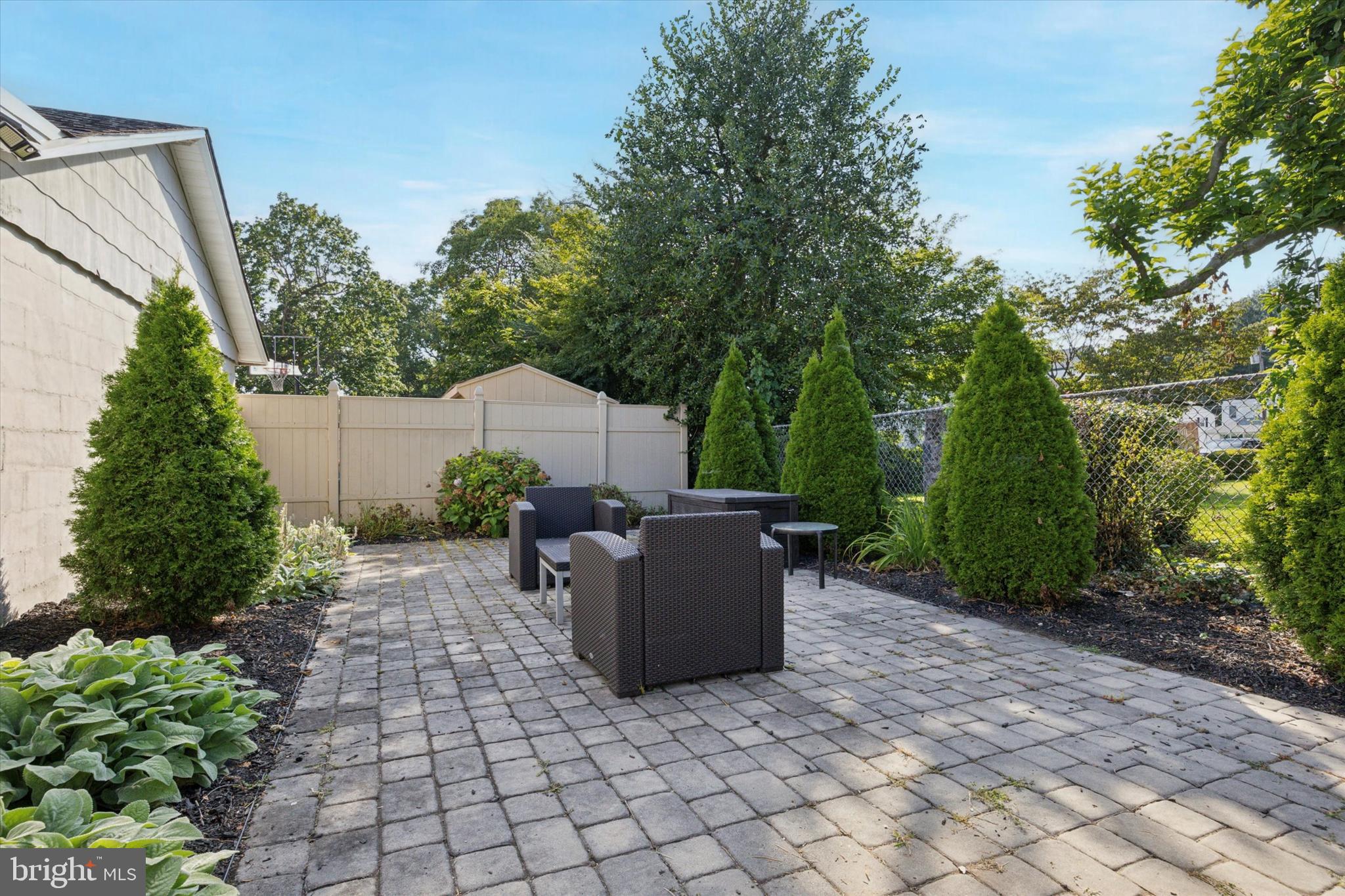 204 Media Line Road Newtown Square, PA 19073 - Photo 13 of 15 a backyard of a house with yard and outdoor seating