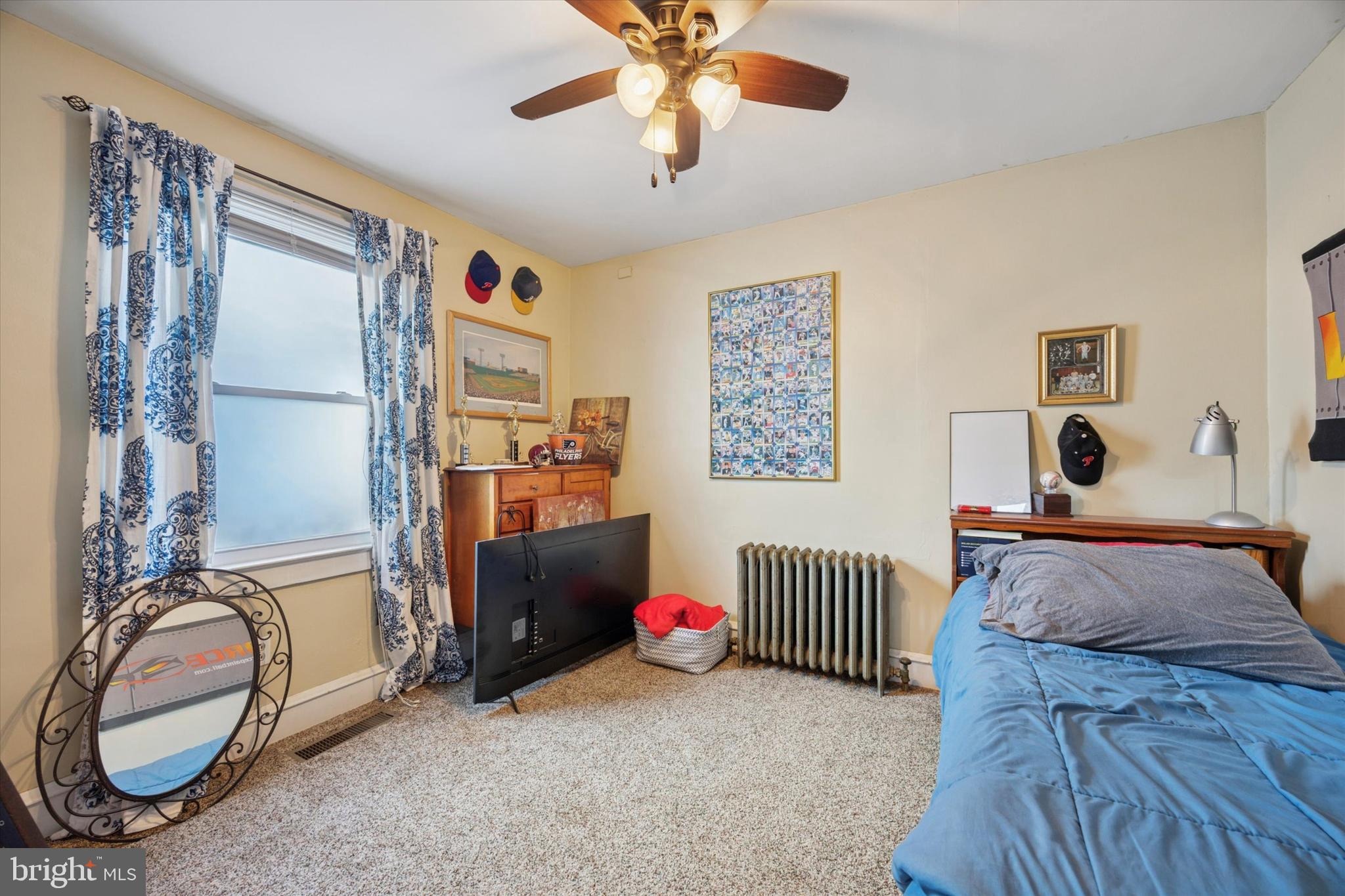 204 Media Line Road Newtown Square, PA 19073 - Photo 3 of 15 a bedroom with bed and a chandelier