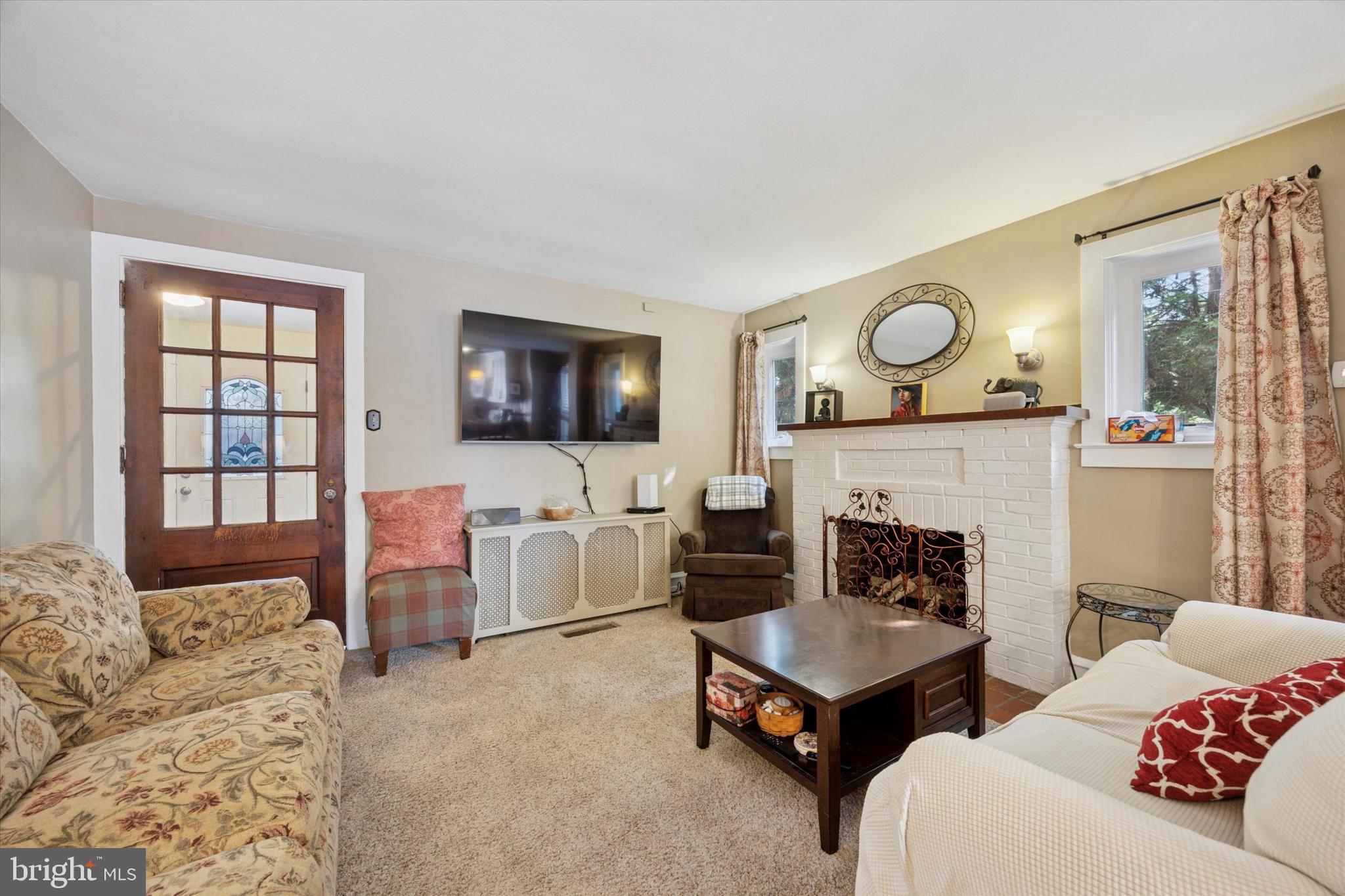 204 Media Line Road Newtown Square, PA 19073 - Photo 5 of 15 a living room with furniture and a flat screen tv