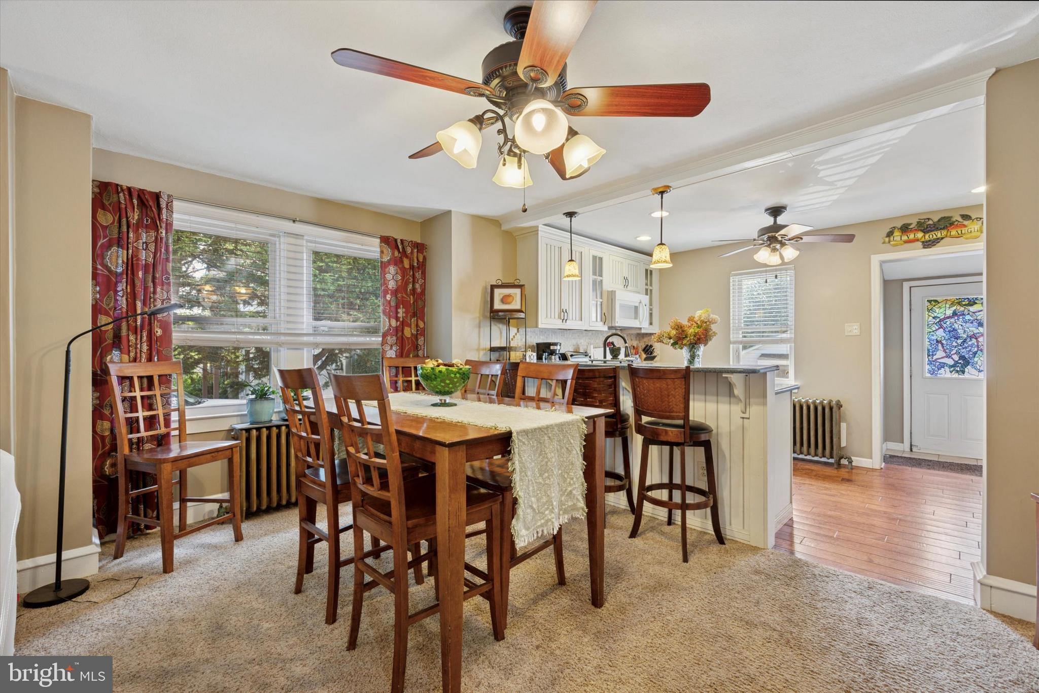 204 Media Line Road Newtown Square, PA 19073 - Photo 6 of 15 a view of a dining room with furniture and chandelier