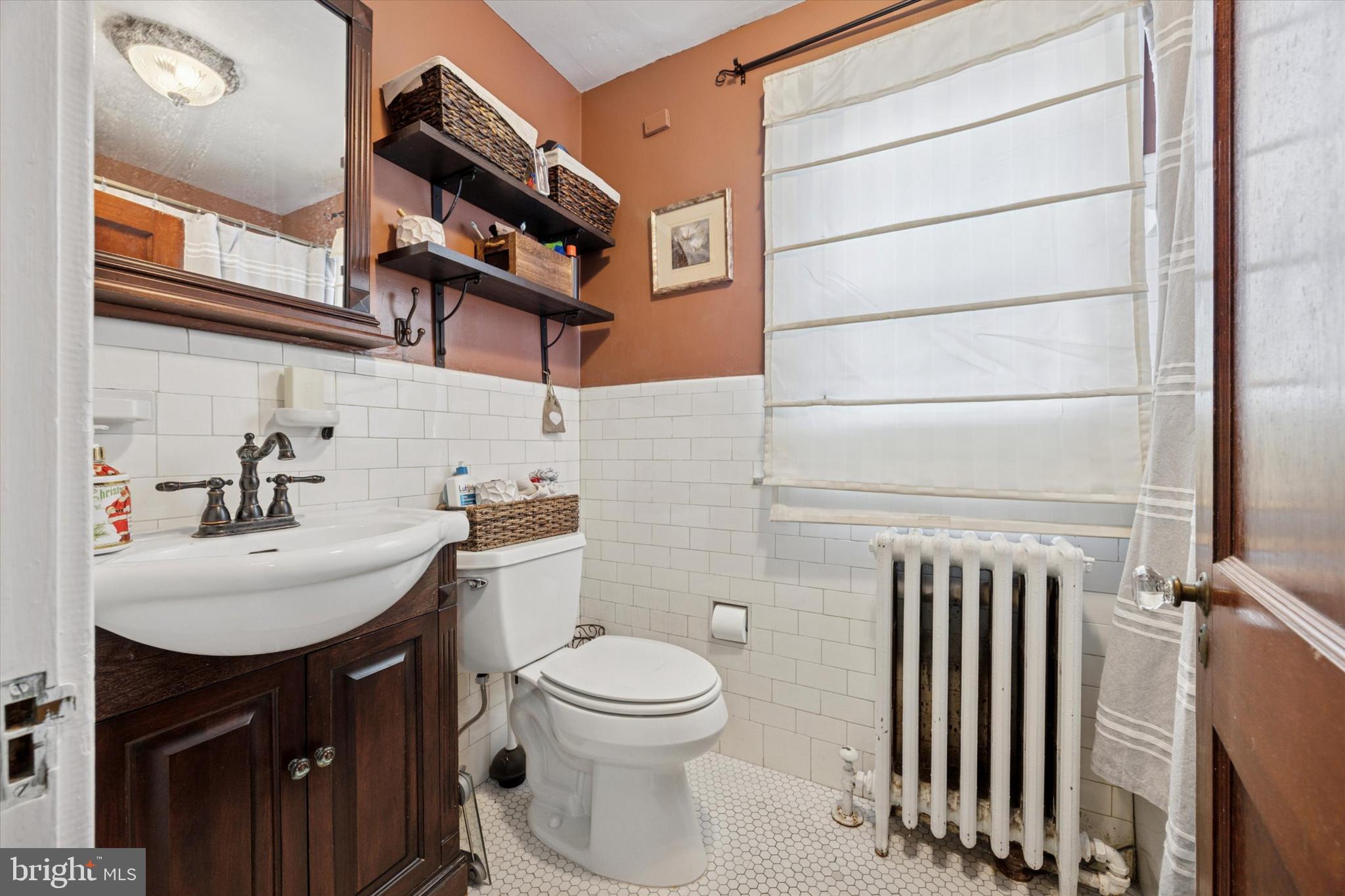 204 Media Line Road Newtown Square, PA 19073 - Photo 9 of 15 a bathroom with a sink a toilet and a mirror