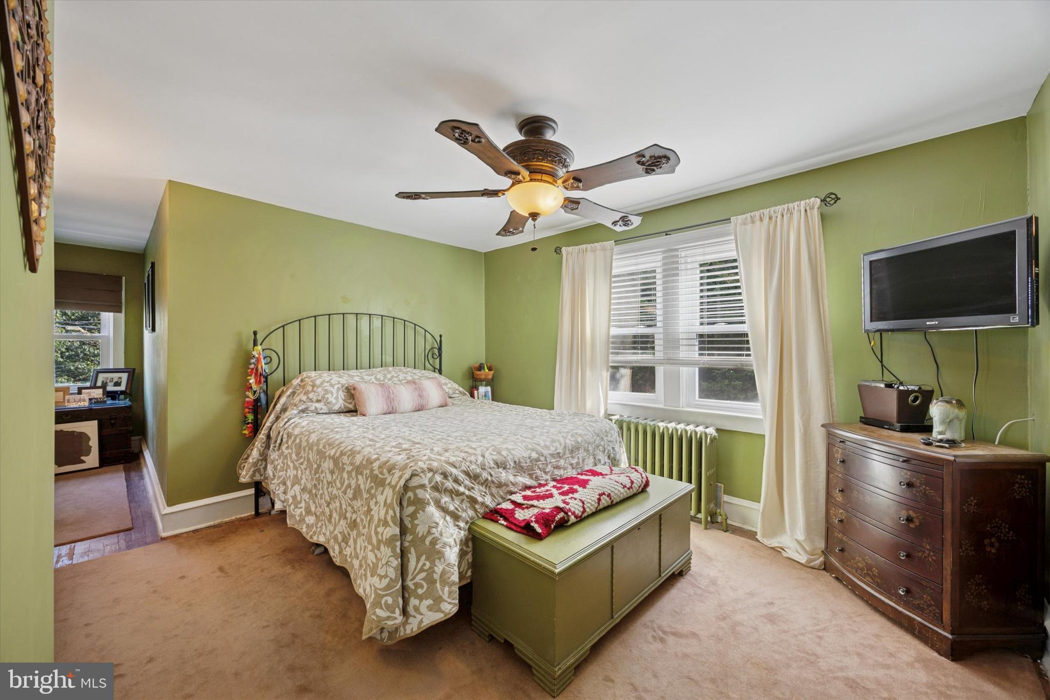 204 Media Line Road Newtown Square, PA 19073 - Photo 10 of 15 a bedroom with a bed and a flat tv screen