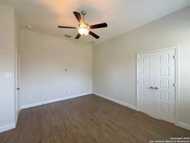 a bathroom with a double vanity sink mirror and shower