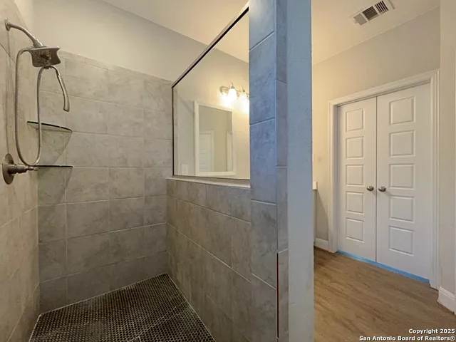 a view of a room with racks on the wall