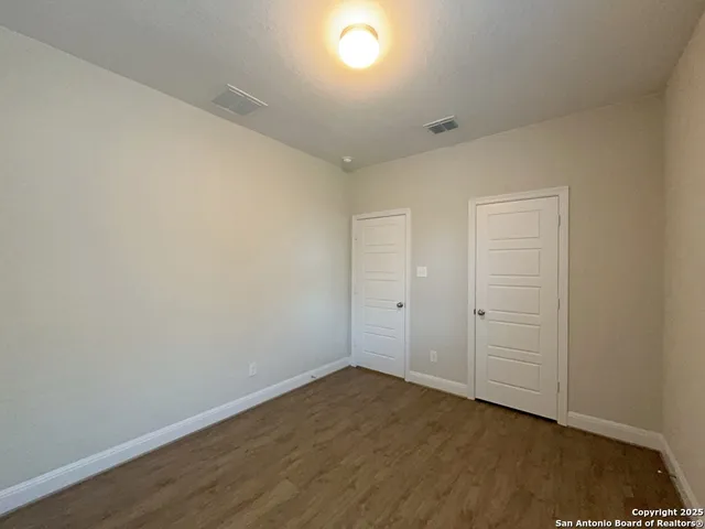 a view of a hallway with closet