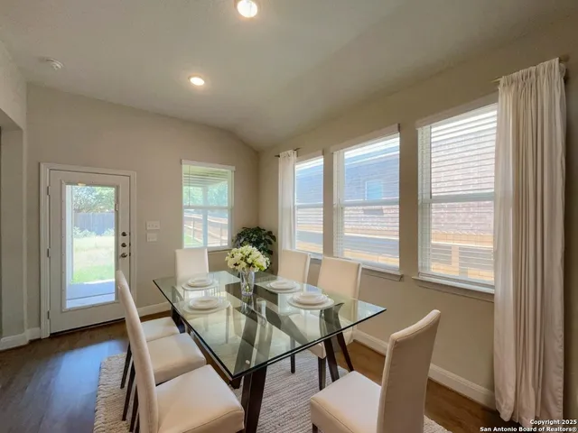 a view of a dining room with furniture window and wooden floor