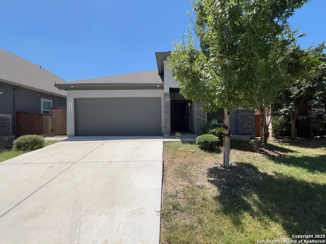 a patio with water view and a tables