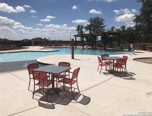 a view of a swimming pool with a yard