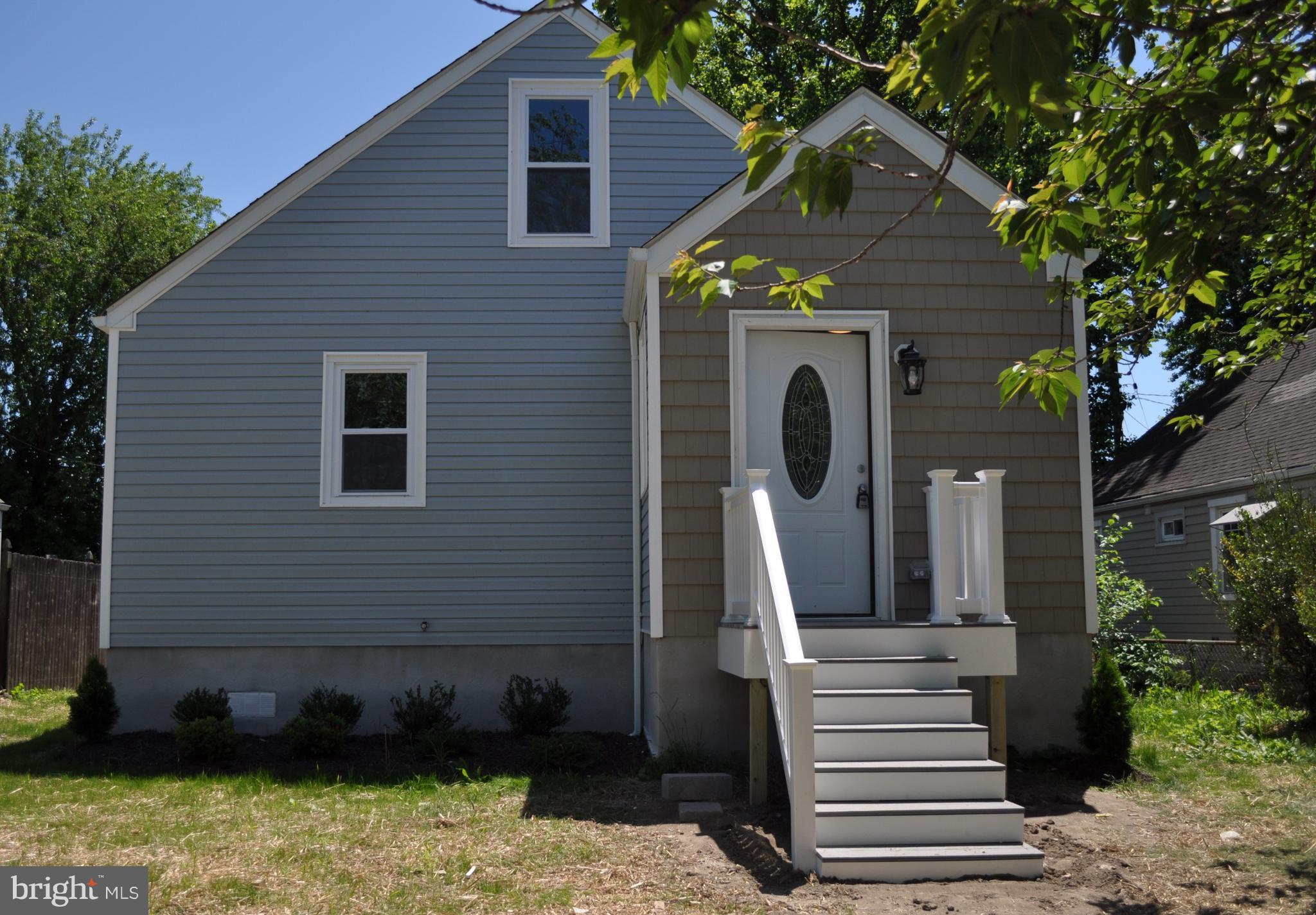 8103 Bullneck Road Baltimore, MD 21222 - Photo 1 of 26 a front view of a house with garden