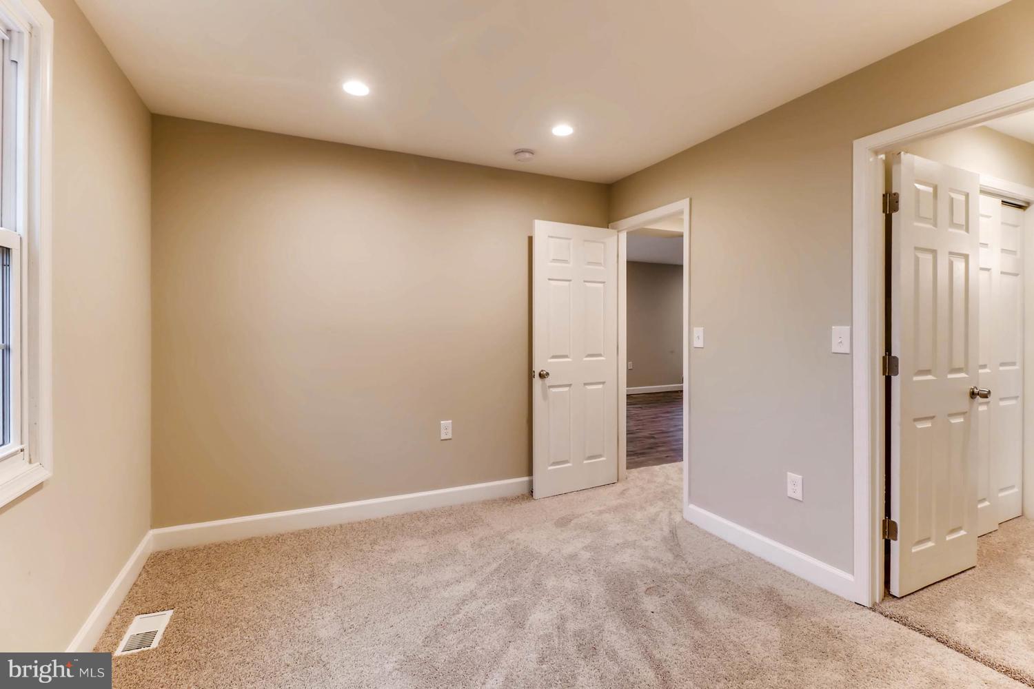 8103 Bullneck Road Baltimore, MD 21222 - Photo 11 of 26 an empty room with closet and a bathroom