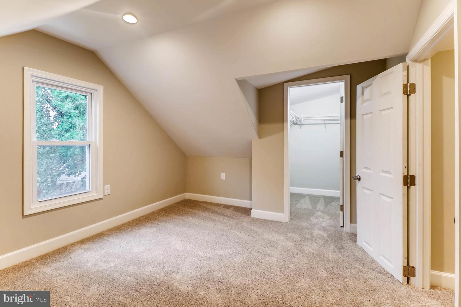 8103 Bullneck Road Baltimore, MD 21222 - Photo 16 of 26 an empty room with windows and closet