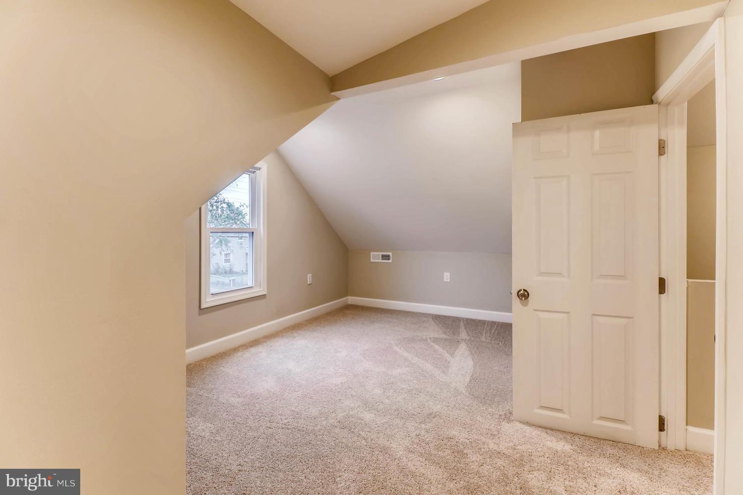 8103 Bullneck Road Baltimore, MD 21222 - Photo 22 of 26 a view of an empty room with a window