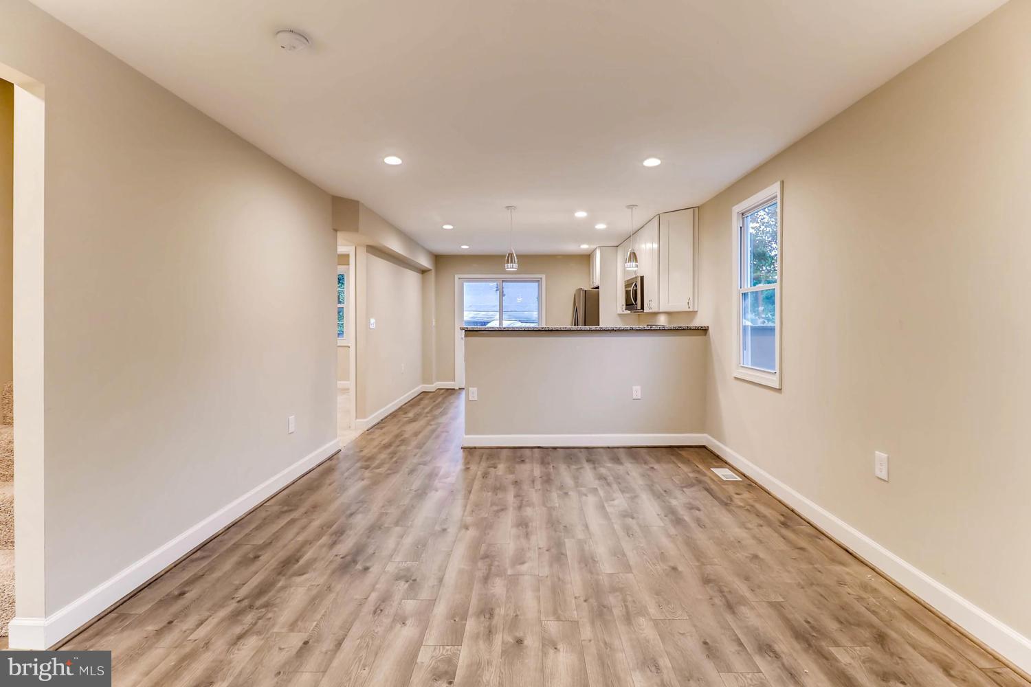 8103 Bullneck Road Baltimore, MD 21222 - Photo 6 of 26 a view of empty room with wooden floor