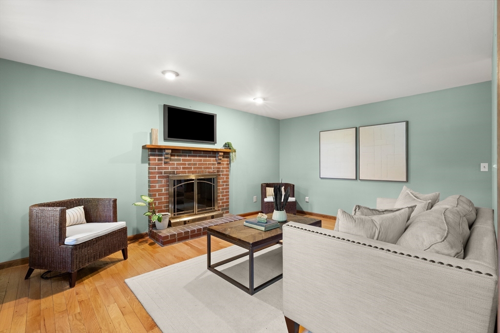 31 Kimball Road Amesbury, MA 01913 - Photo 9 of 40 a living room with furniture and a fireplace