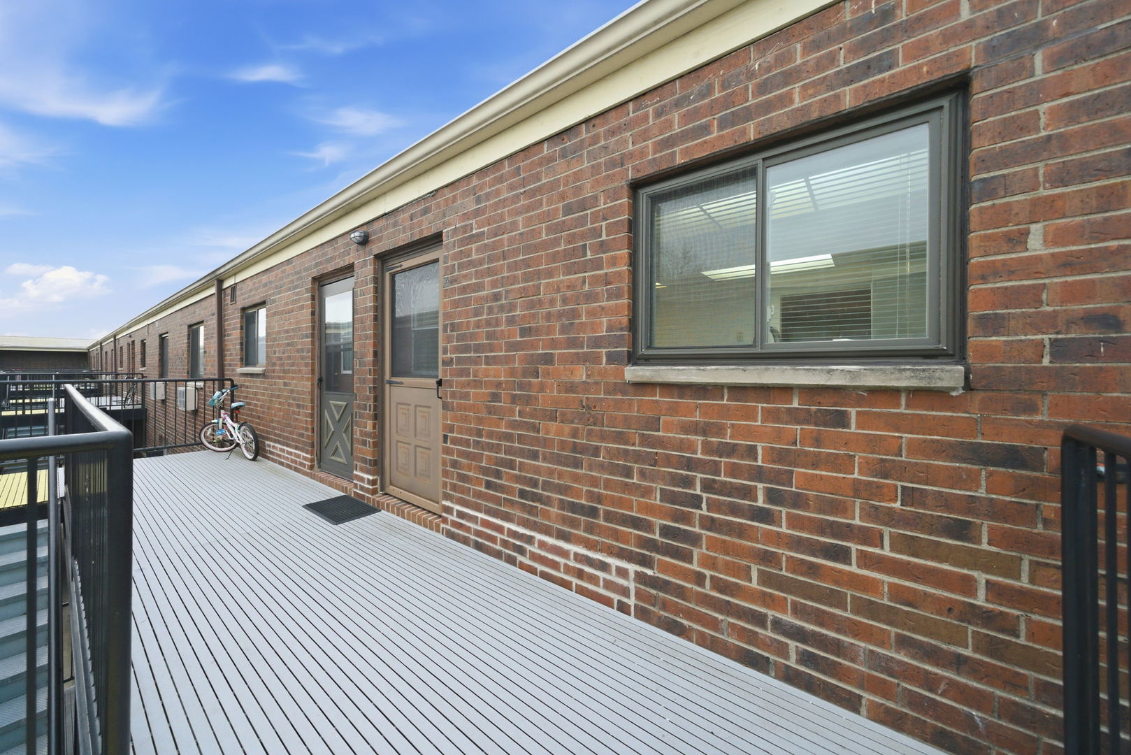 940 North Rohlwing Road, Unit 201A Addison, IL 60101 - Photo 14 of 15 a view of a brick house with wooden floor