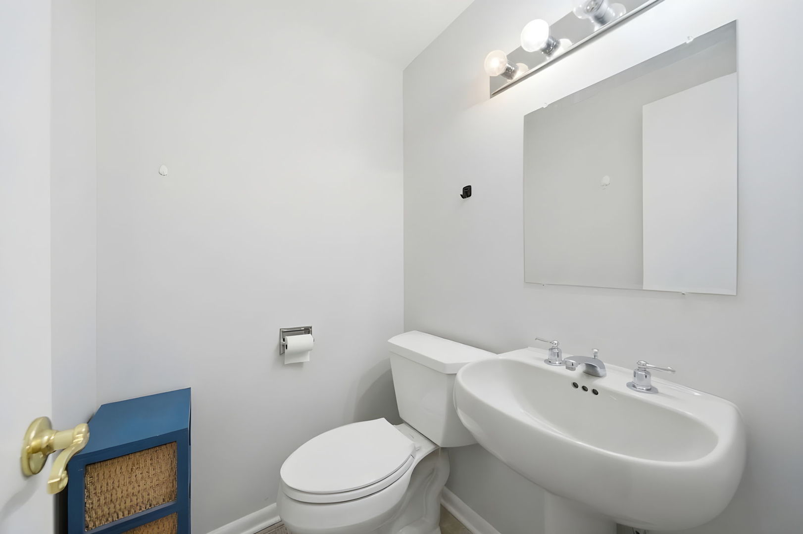 940 North Rohlwing Road, Unit 201A Addison, IL 60101 - Photo 9 of 15 a bathroom with a toilet a sink and mirror