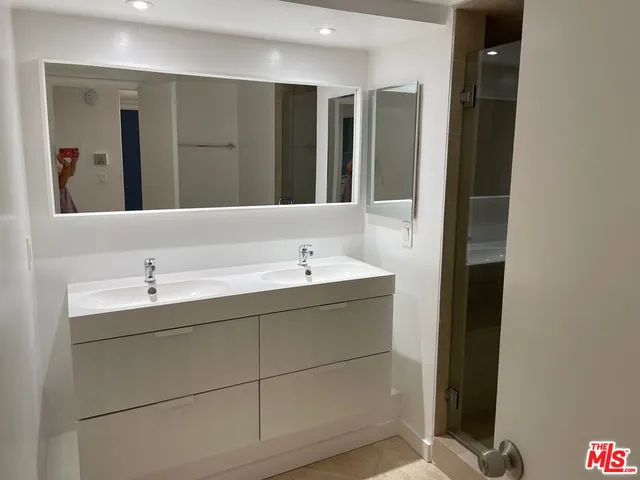 a bathroom with a bathtub and a sink
