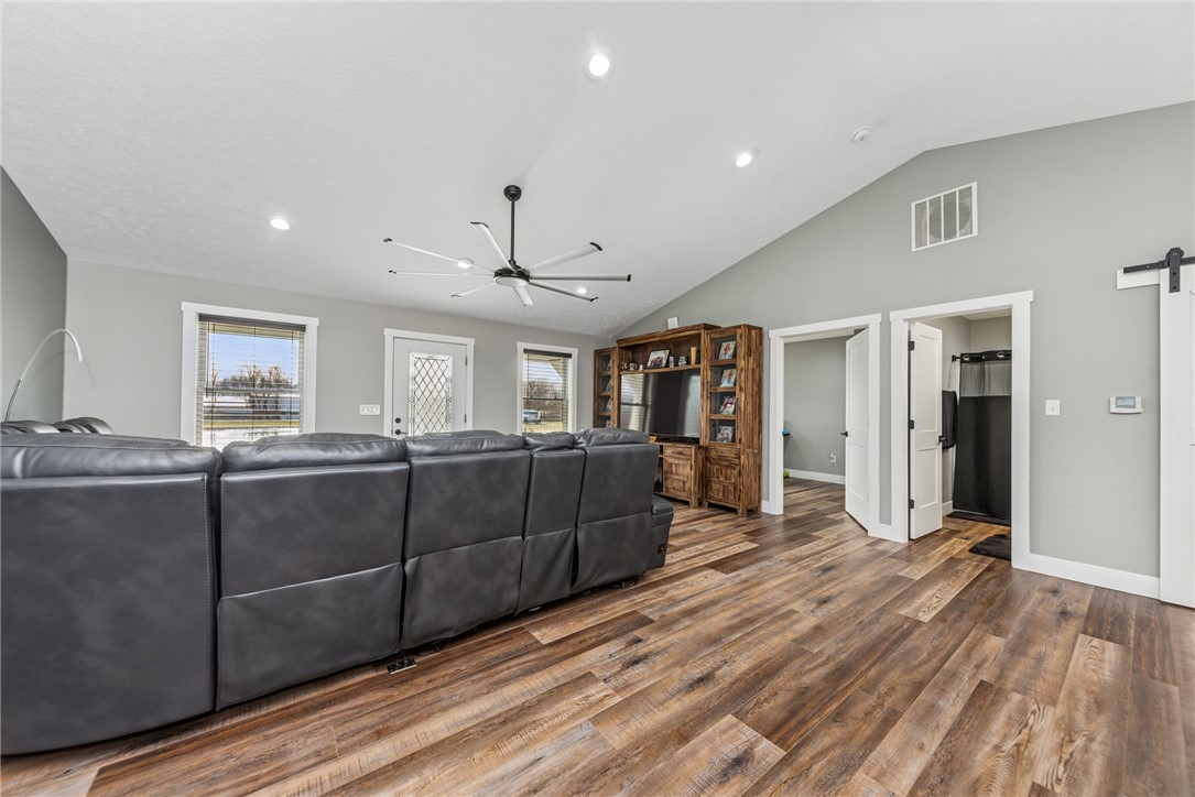 1602 Westboro Road Blanchester, OH 45107 - Photo 32 of 81 This inviting living space features warm flooring and high ceilings, creating an airy and comfortable atmosphere.