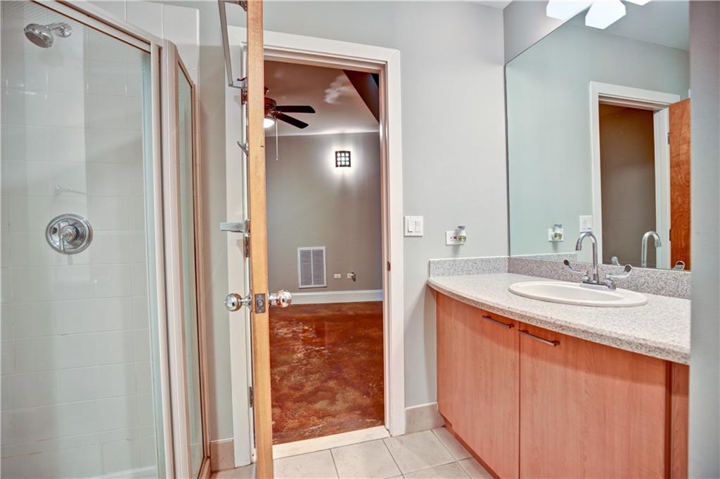 123 Luckie Street Northwest, Unit 2510 Atlanta, GA 30303 - Photo 11 of 28 a bathroom with a sink and a mirror