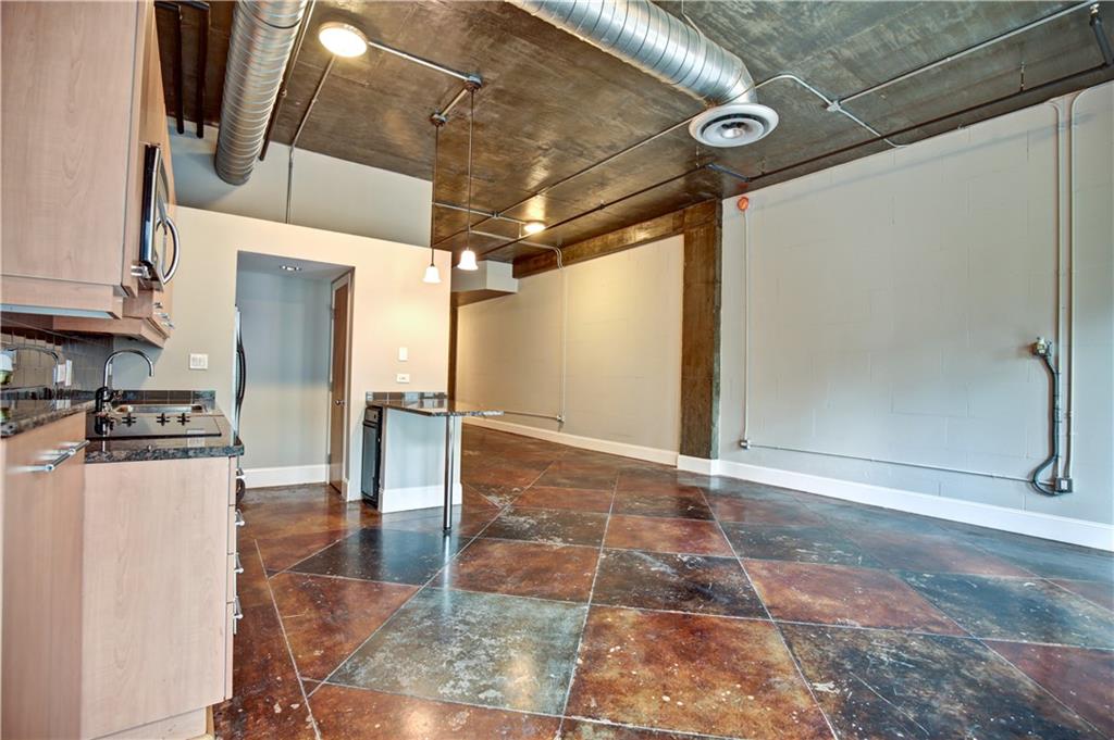 123 Luckie Street Northwest, Unit 2510 Atlanta, GA 30303 - Photo 14 of 28 a view of a refrigerator in kitchen and an empty room