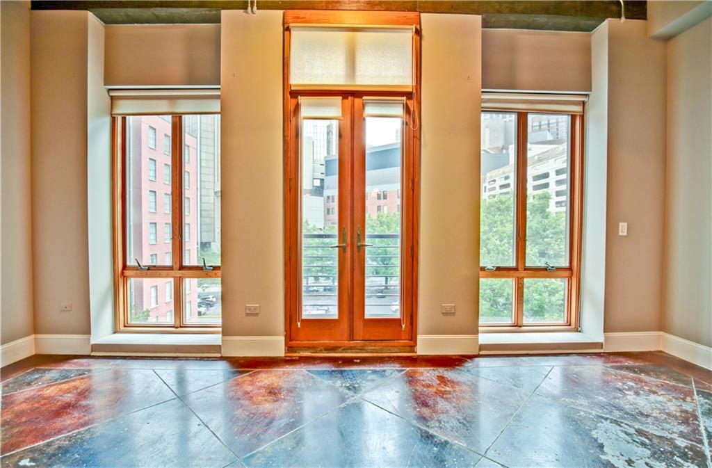 123 Luckie Street Northwest, Unit 2510 Atlanta, GA 30303 - Photo 20 of 28 a view of an empty room with a window and wooden floor
