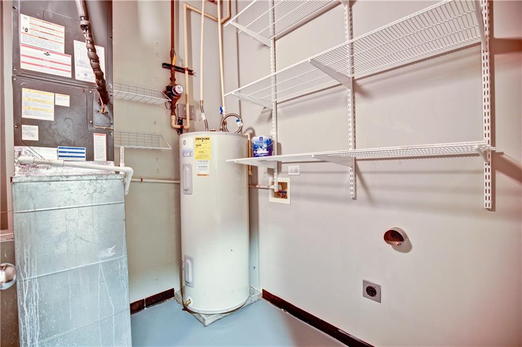 123 Luckie Street Northwest, Unit 2510 Atlanta, GA 30303 - Photo 21 of 28 a view of storage and utility room with washer and dryer