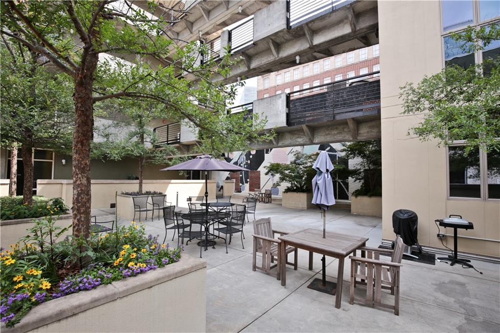 123 Luckie Street Northwest, Unit 2510 Atlanta, GA 30303 - Photo 26 of 28 a view of a chairs and tables in patio