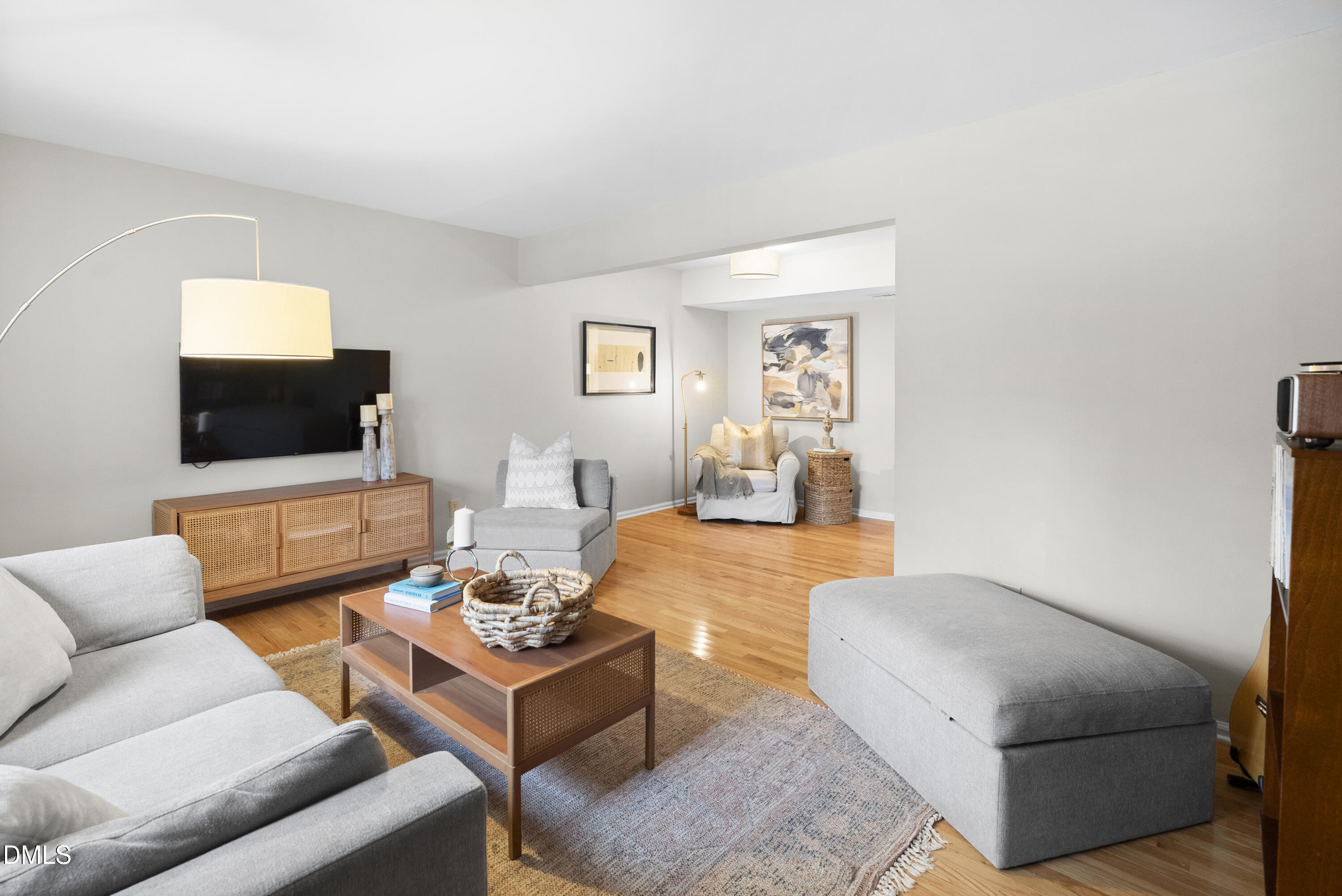 1515 Hemphill Drive Raleigh, NC 27609 - Photo 2 of 46 a living room with furniture and a flat screen tv