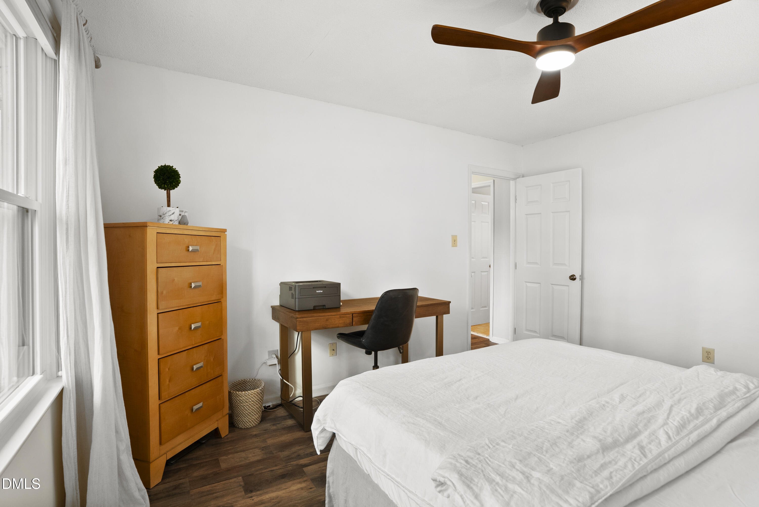 1515 Hemphill Drive Raleigh, NC 27609 - Photo 24 of 46 a bedroom with a bed and a dresser
