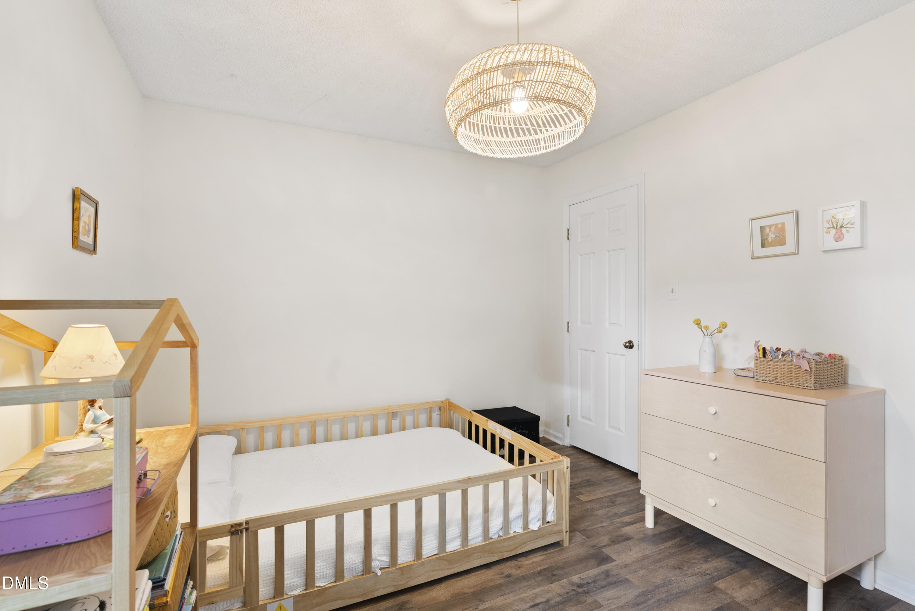 1515 Hemphill Drive Raleigh, NC 27609 - Photo 27 of 46 a bedroom with a bed and a chandelier