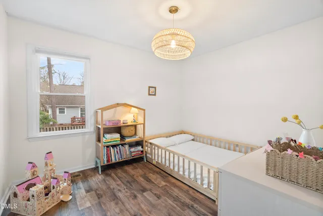 a bedroom with furniture and a window