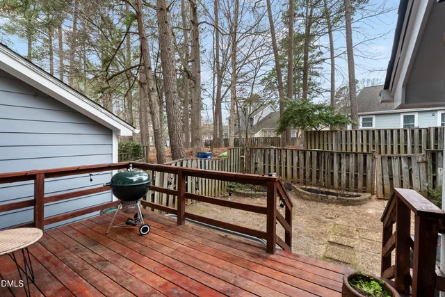 a view of deck with a table and chairs and wooden floor