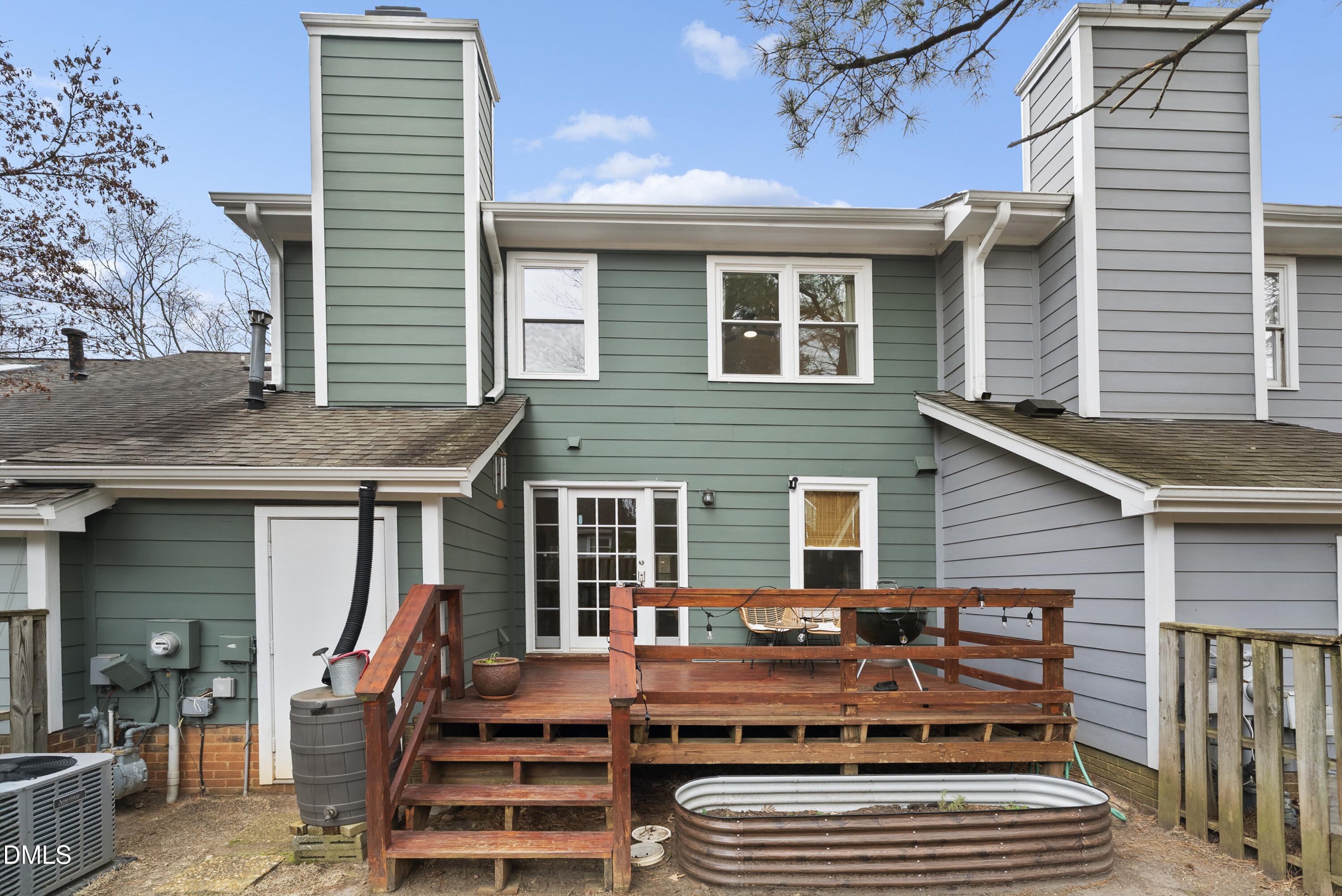 1515 Hemphill Drive Raleigh, NC 27609 - Photo 37 of 46 a view of a house with wooden deck and furniture