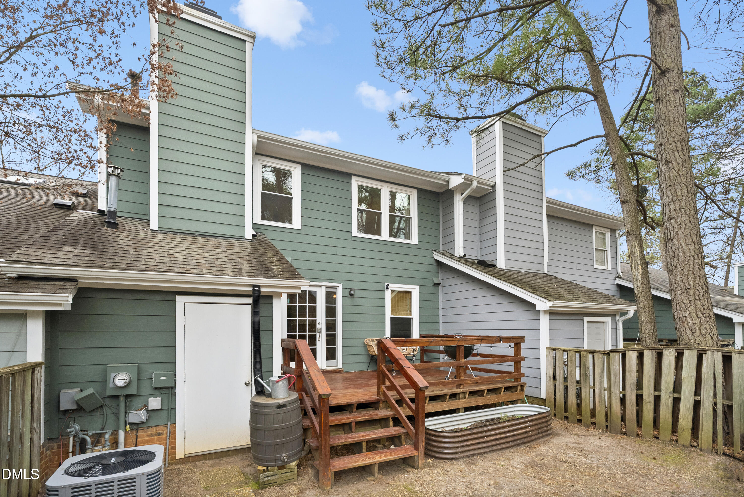 1515 Hemphill Drive Raleigh, NC 27609 - Photo 39 of 46 a backyard of a house with barbeque oven table and chairs
