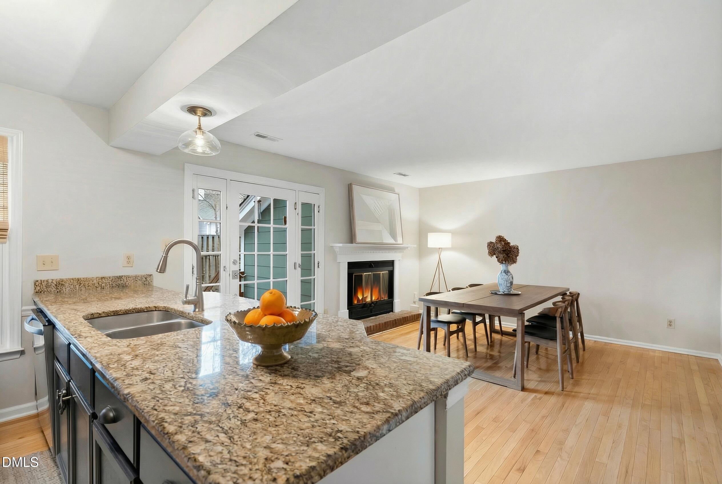 1515 Hemphill Drive Raleigh, NC 27609 - Photo 9 of 46 a living room with furniture a fireplace and kitchen view