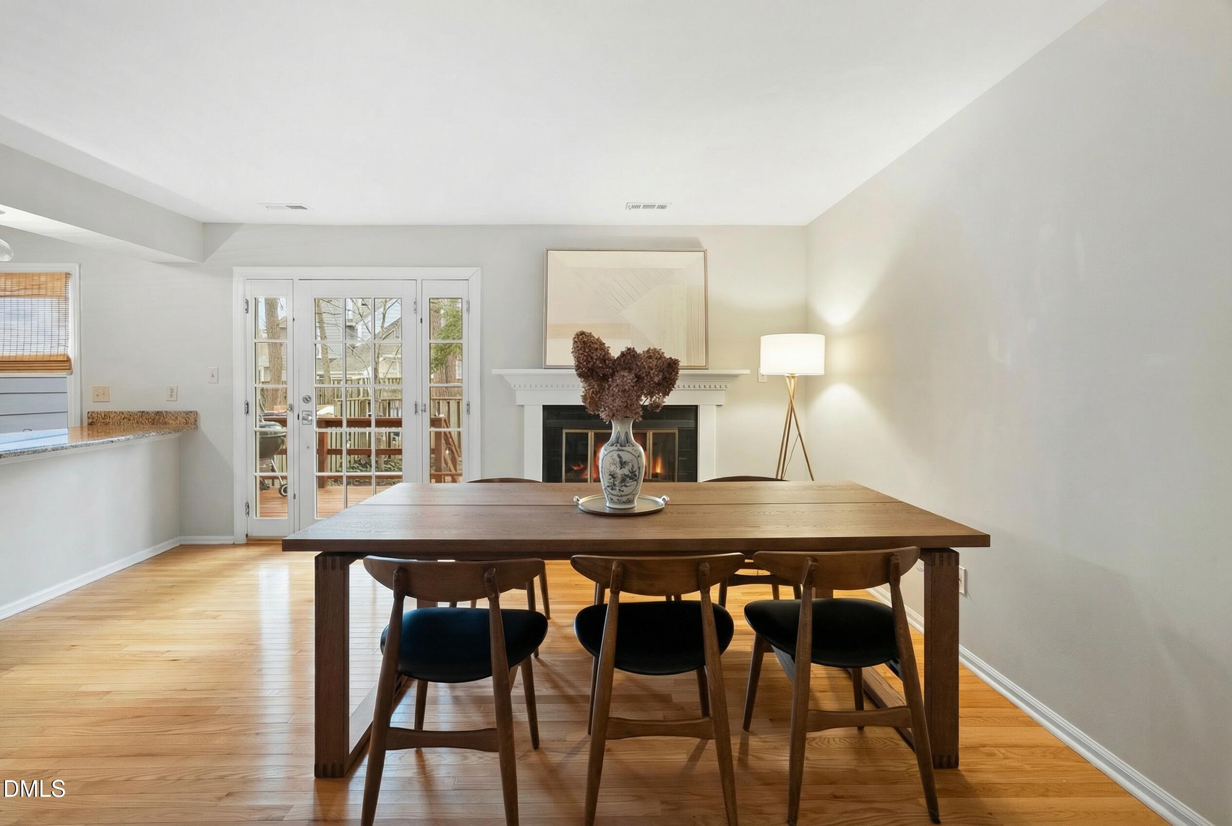 1515 Hemphill Drive Raleigh, NC 27609 - Photo 10 of 46 a view of a dining room with furniture and wooden floor