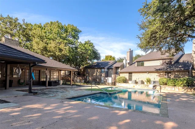 a front view of a building and trees