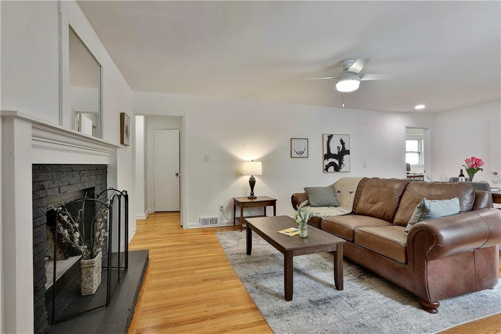 2037 B Lively Ridge Road Northeast Atlanta, GA 30329 - Photo 12 of 18 a living room with furniture and a fireplace