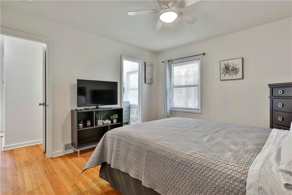 2037 B Lively Ridge Road Northeast Atlanta, GA 30329 - Photo 14 of 18 a bedroom with a bed and a flat screen tv