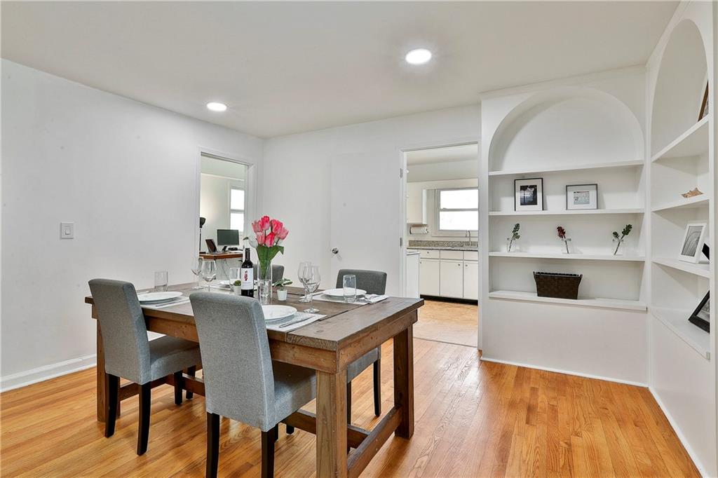 2037 B Lively Ridge Road Northeast Atlanta, GA 30329 - Photo 7 of 18 a view of a dining room with furniture and wooden floor