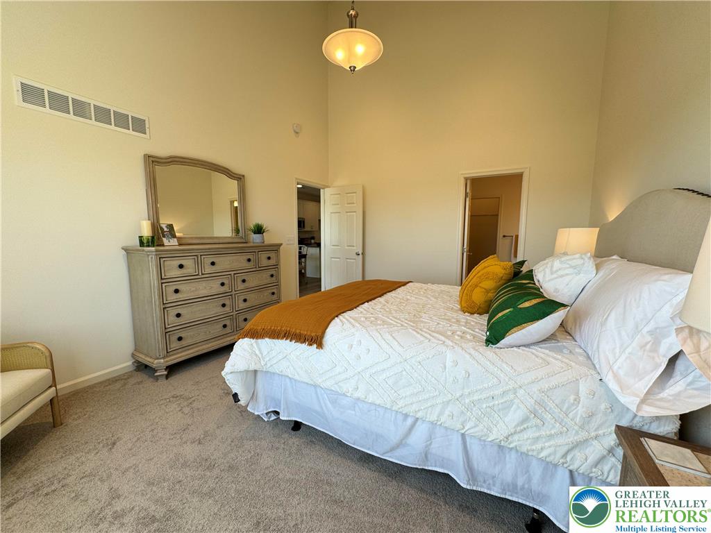 113 Timber Trail, Unit 54 Easton, PA 18045 - Photo 11 of 24 a bedroom with a bed and a couch