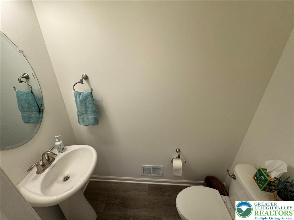 113 Timber Trail, Unit 54 Easton, PA 18045 - Photo 4 of 24 a bathroom with a sink mirror and toilet