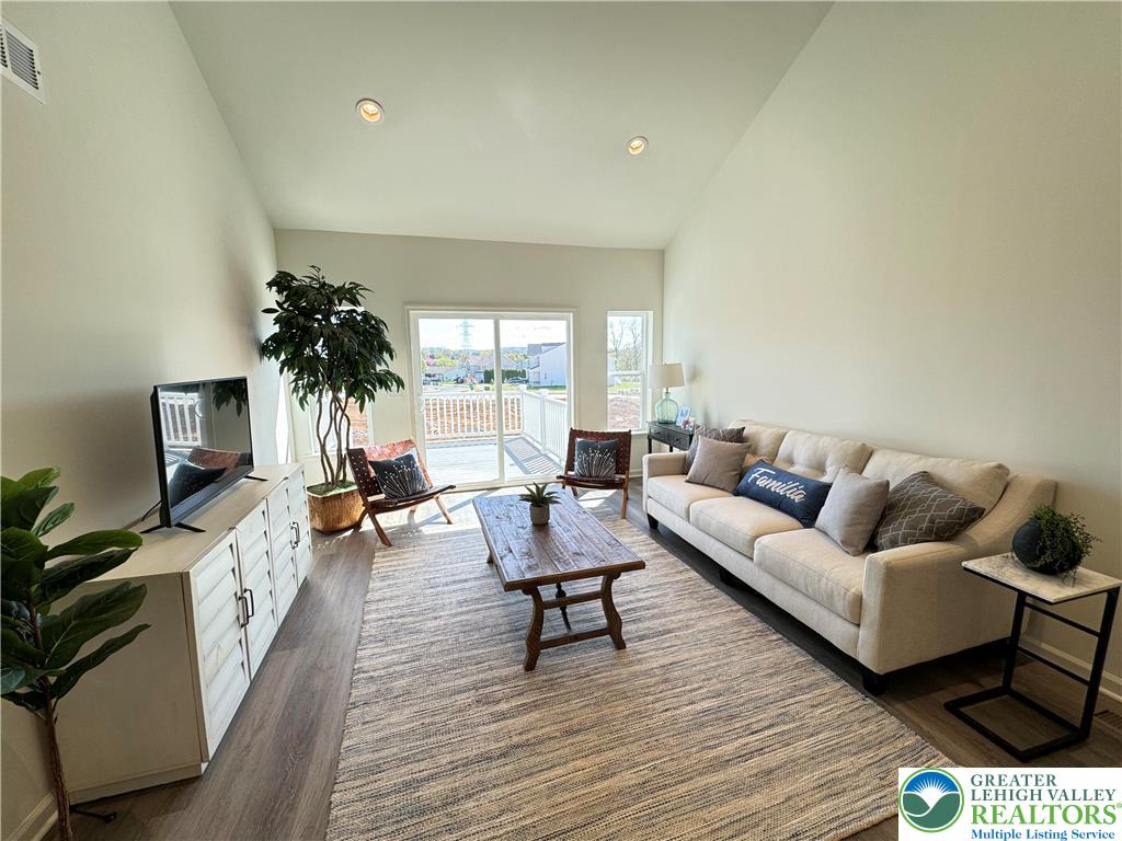 113 Timber Trail, Unit 54 Easton, PA 18045 - Photo 8 of 24 a living room with furniture and a potted plant
