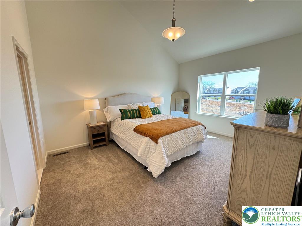 113 Timber Trail, Unit 54 Easton, PA 18045 - Photo 10 of 24 a bedroom with a bed and a table